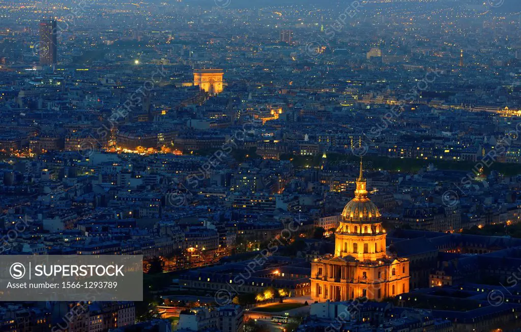 Aerial view of Paris by dusk. Illuminated Arc de Triomphe and Invalides in Paris,France,Europe.