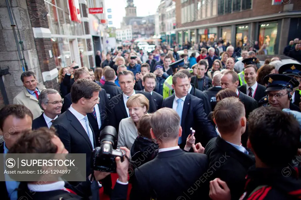 angela merkel meets the dutch prime minister Mark Rutte in nijmegen en recieves a doctorate.