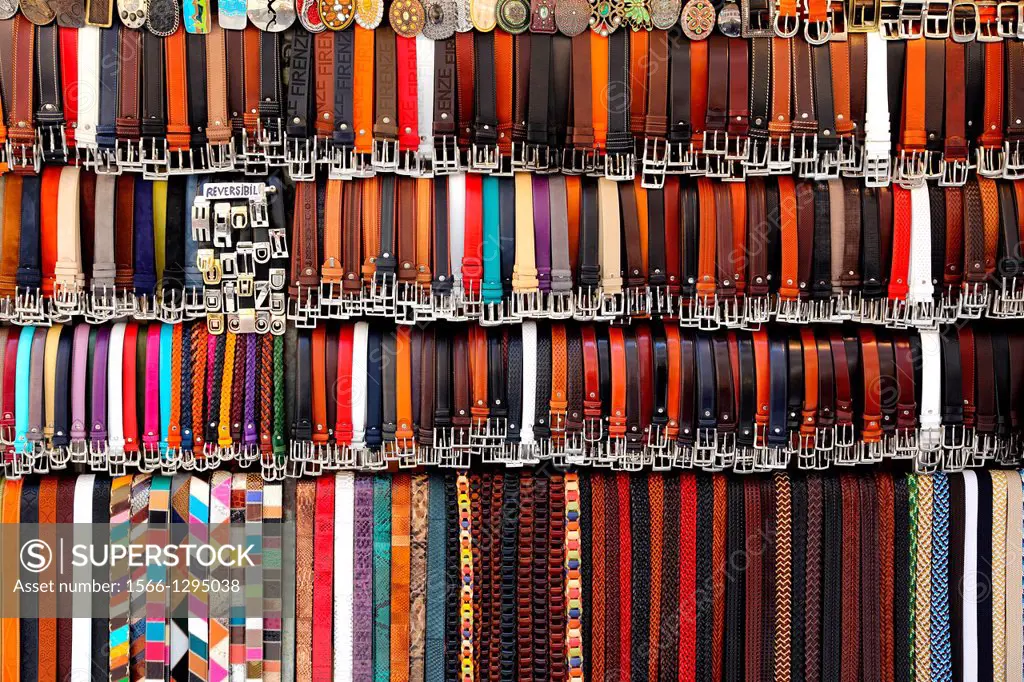 Leather belts on display at a market in Florence Italy.