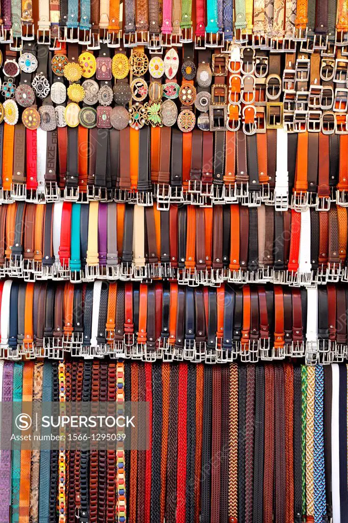 Belts on display in a market in Florence Italy.