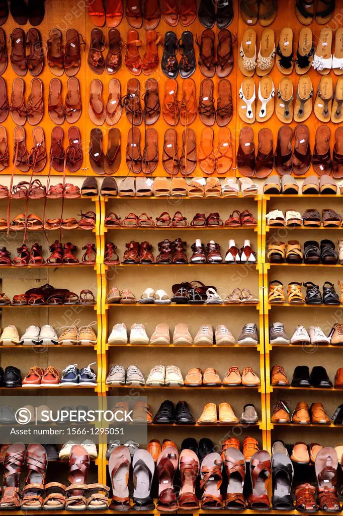 Shoes and sandals on display at a market in Florence Italy.
