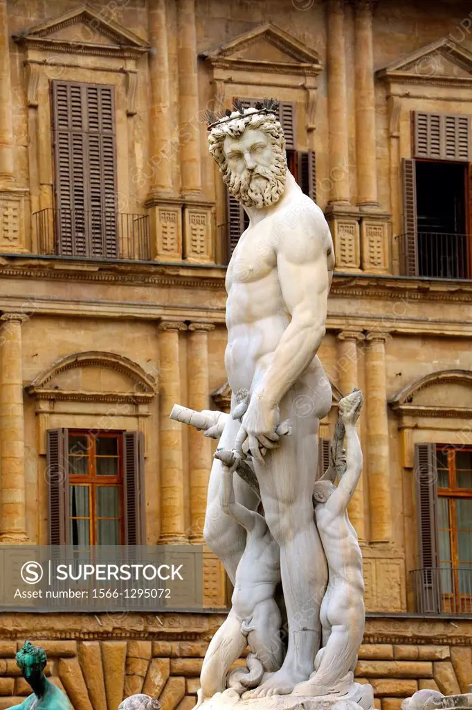 Statue of Neptune that is part of Fontana di Nettuno standing in Piazza della Signoria in Florence Italy.