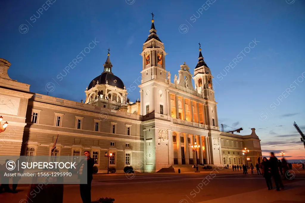 the illuminated Almudena Cathedral Santa Maria la Real de La Almudena in Madrid at night, Spain, Europe.
