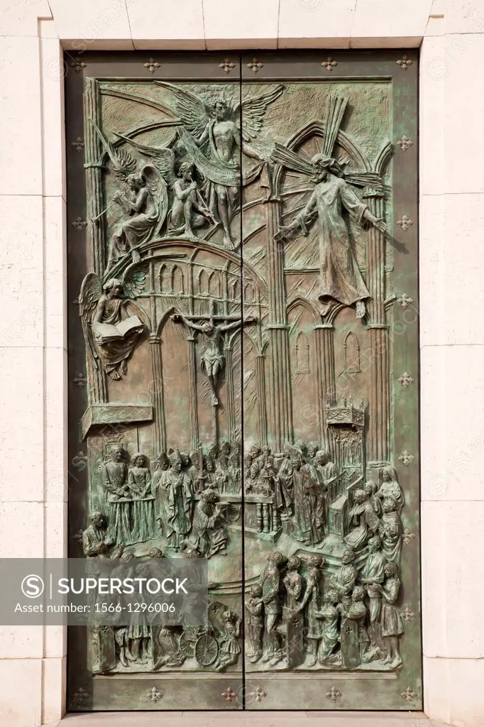religious relief on the door of the catholic Almudena Cathedral Santa Maria la Real de La Almudena in Madrid, Spain, Europe.