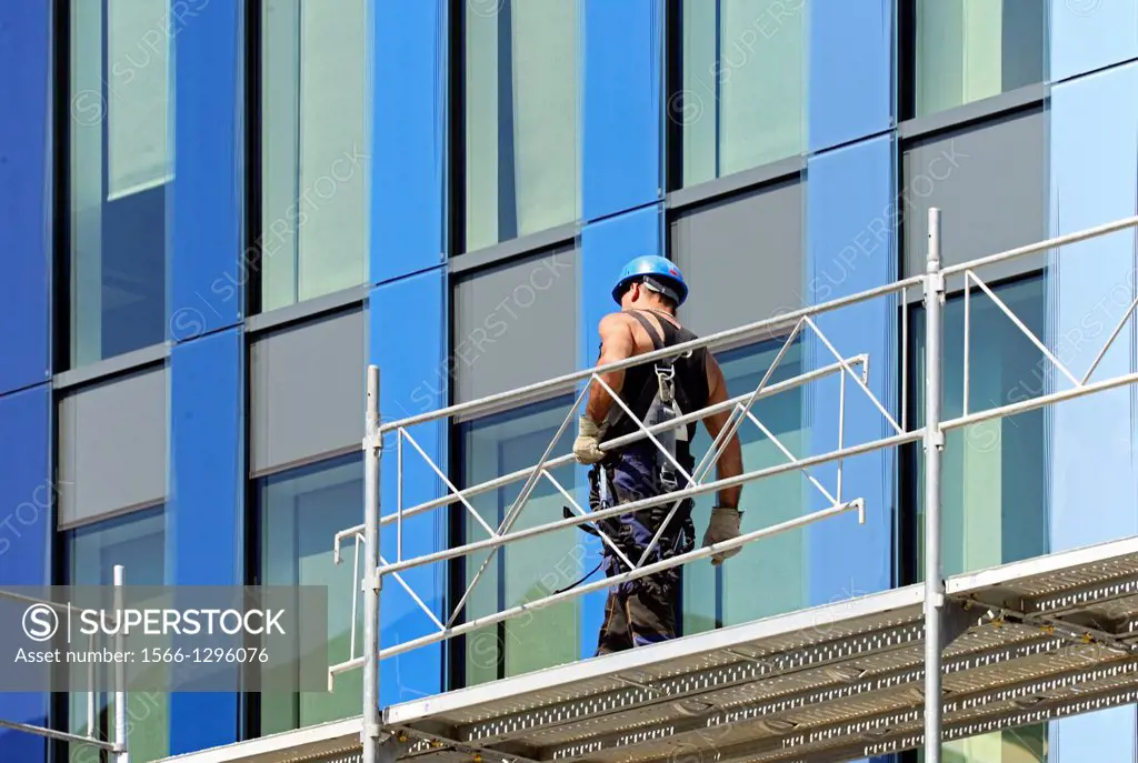 construction worker at work on scaffolding, Geneva, Switzerland