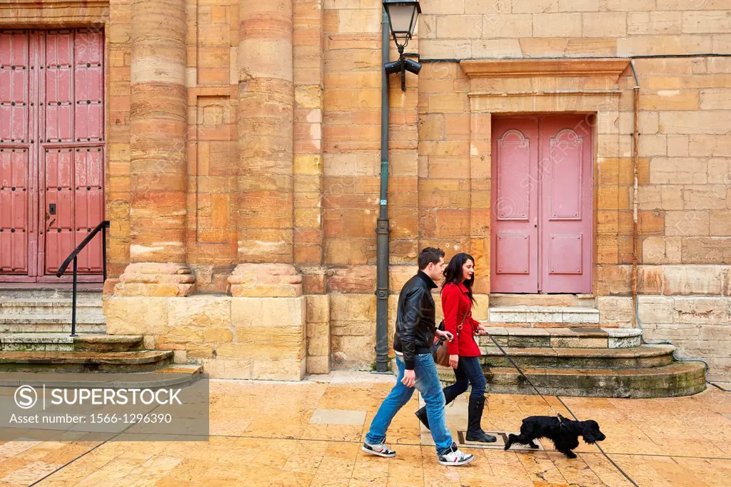 Couple walking with dog, Constitution square, Oviedo, Asturias, Spain.
