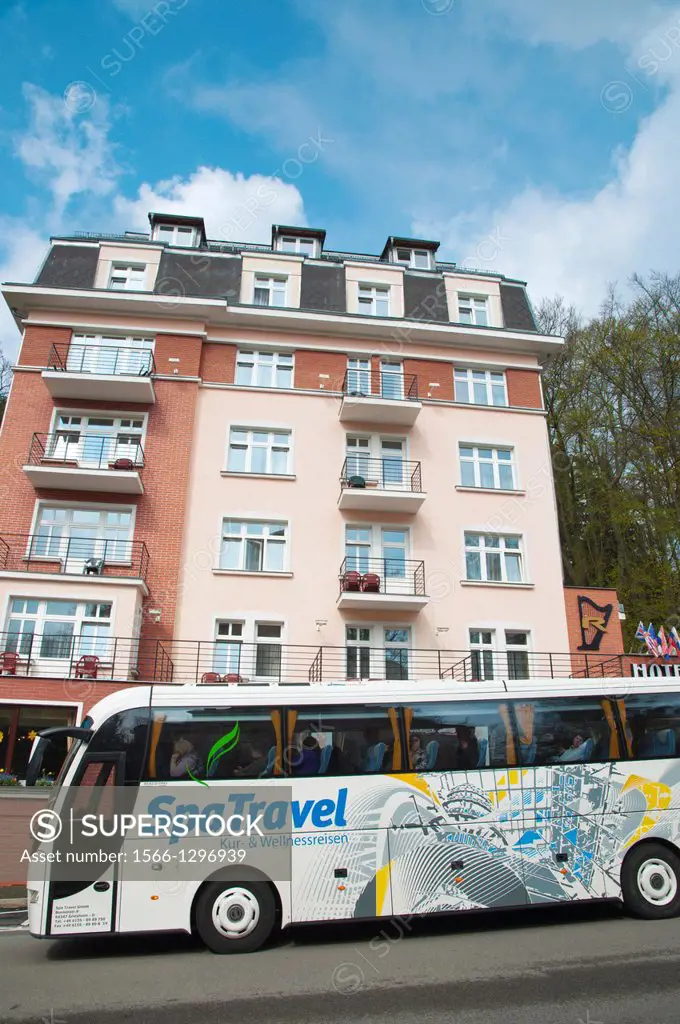Tourist bus in front of a hotel Marianske Lazne aka Marienbad spa town Karlovy vary region Czech Republic Europe.