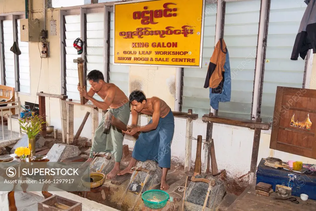 Men making gold leaf, King Galon Gold Leaf Workshop, Mandalay, Myanmar, (Burma).
