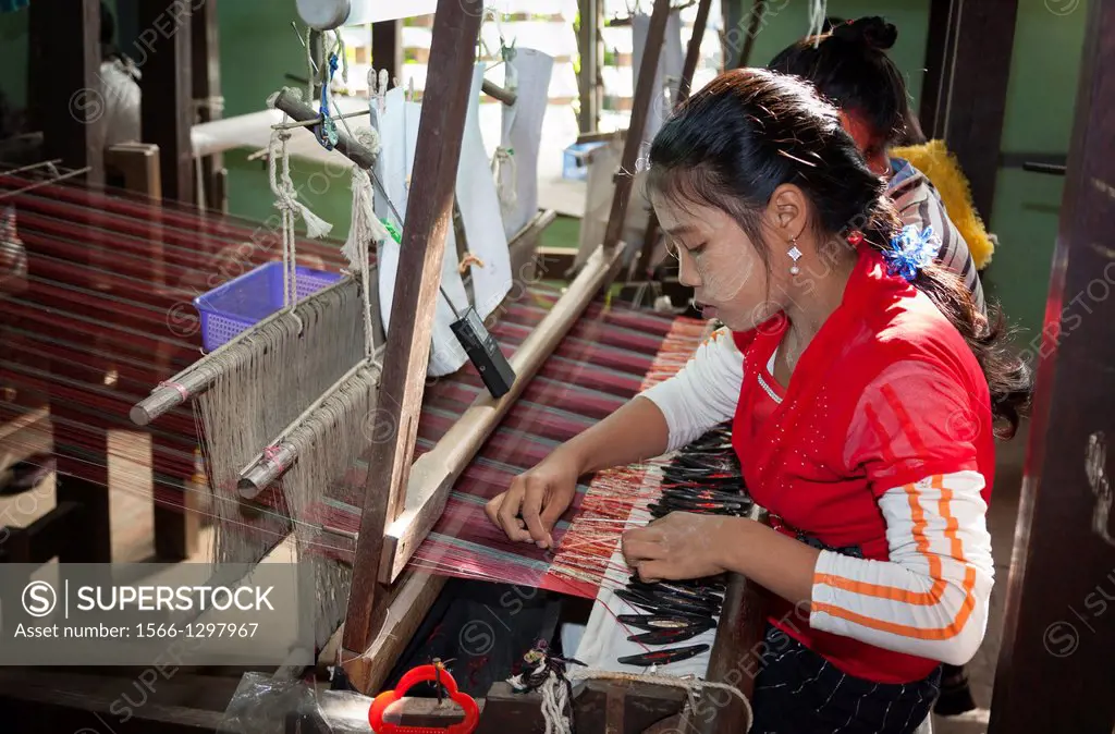 Woman weaving on a loom, Thein Nyo silk weaving workshop, Amarapura, Mandalay, Myanmar, (Burma).