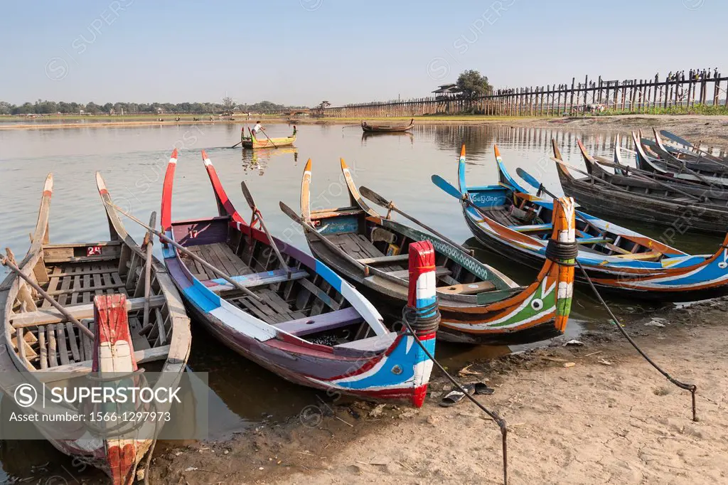 Boats on Taungthaman Lake beside U Bein wooden bridge, Amarapura, Mandalay, Myanmar, (Burma).