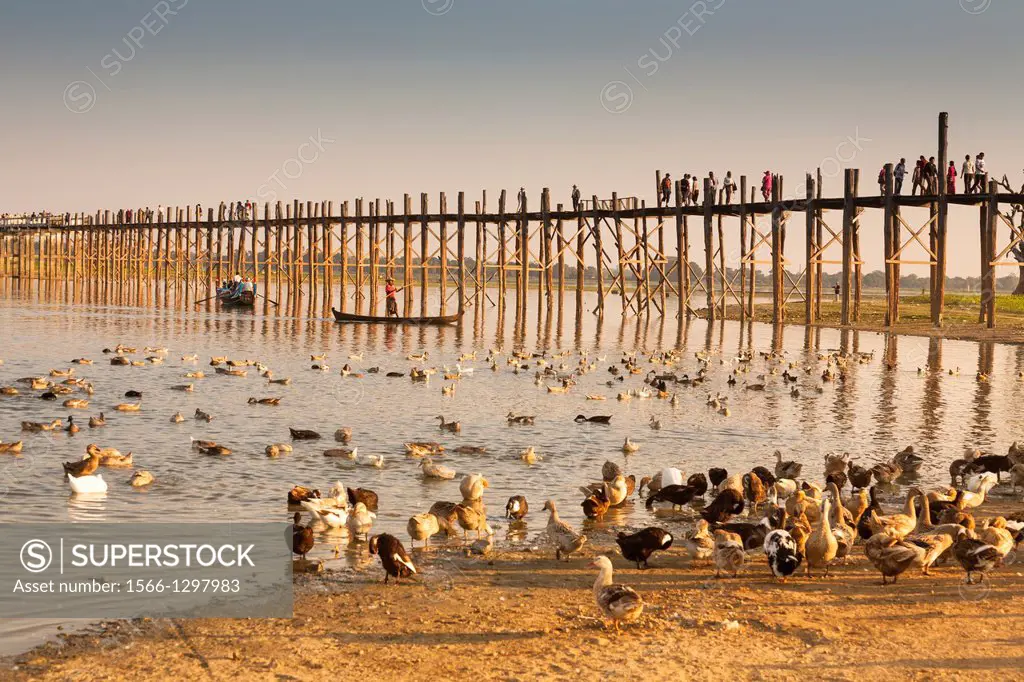 U Bein wooden bridge, worlds longest teak footbridge, crossing Taungthaman Lake, Amarapura, Mandalay, Myanmar, (Burma).
