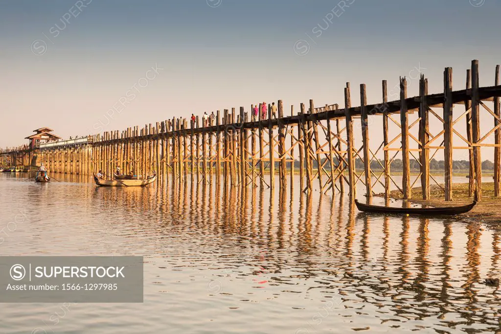 U Bein wooden bridge, worlds longest teak footbridge, crossing Taungthaman Lake, Amarapura, Mandalay, Myanmar, (Burma).