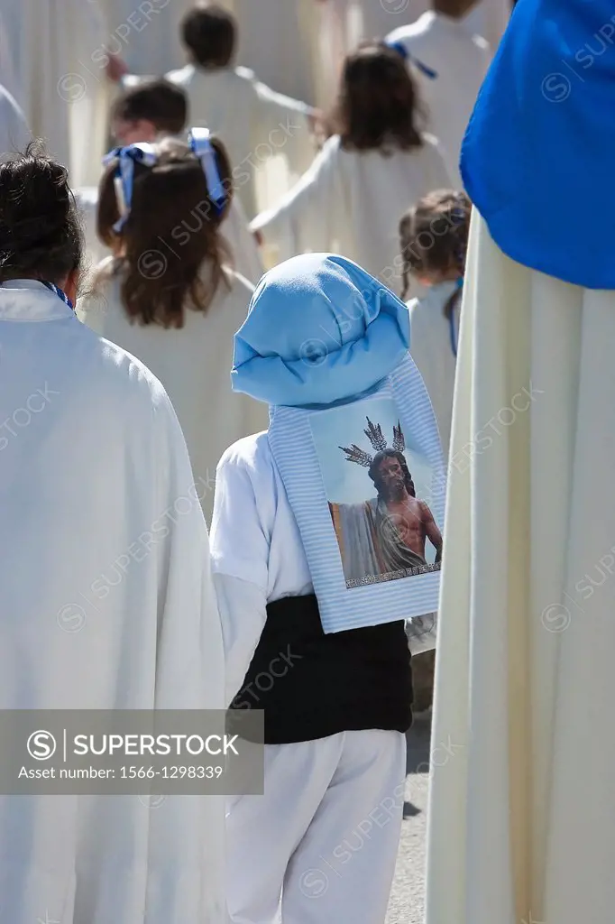 Boy dressed in costalero during a procession of holy week, Andalucia, Spain.