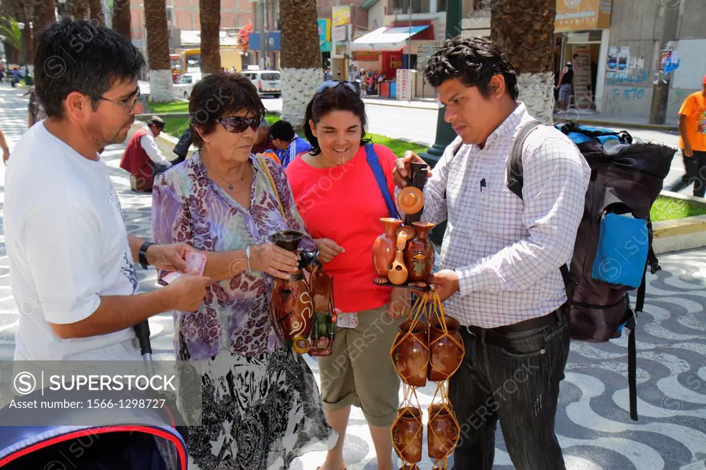 Peru, Tacna, Avenida Bolognese, Parque de Locomotora, public park, promenade, street vendor, souvenir, clay pots, handicraft, Hispanic, man, woman, co...