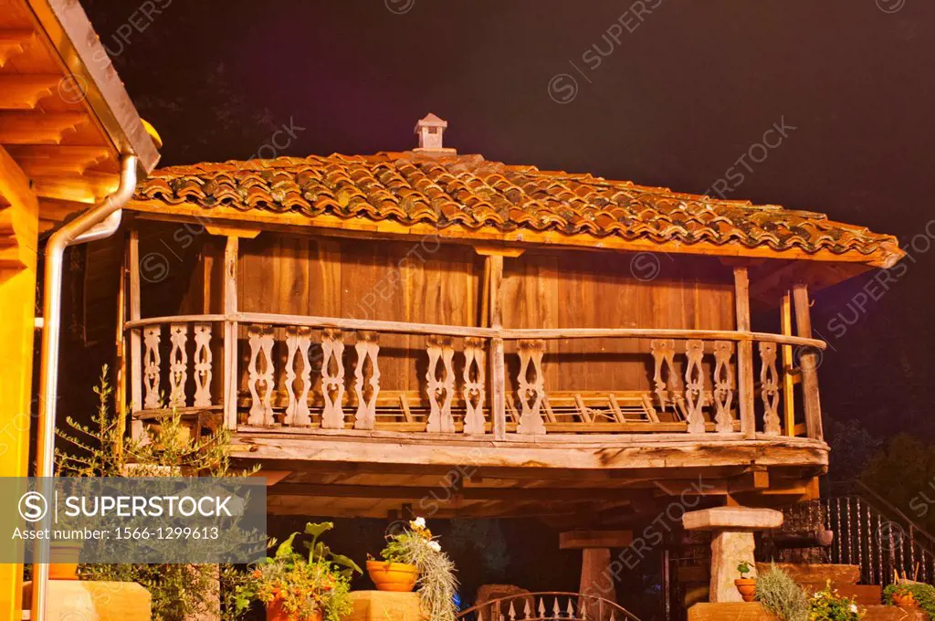 Horreo,ancient fruit store at Pola de Somiedo, by night in the reain, Somiedo Natural Park, Cantabric mountainous chain, Asturias, northern Spain.