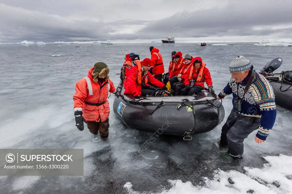 Guests from the Lindblad Expedition ship National Geographic Explorer enjoy Brown Bluff, Antarctica by Zodiac.