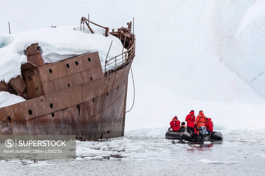 Guests from the Lindblad Expedition ship National Geographic Explorer enjoy the wreck of the Guvenoren, Antarctica by Zodiac.