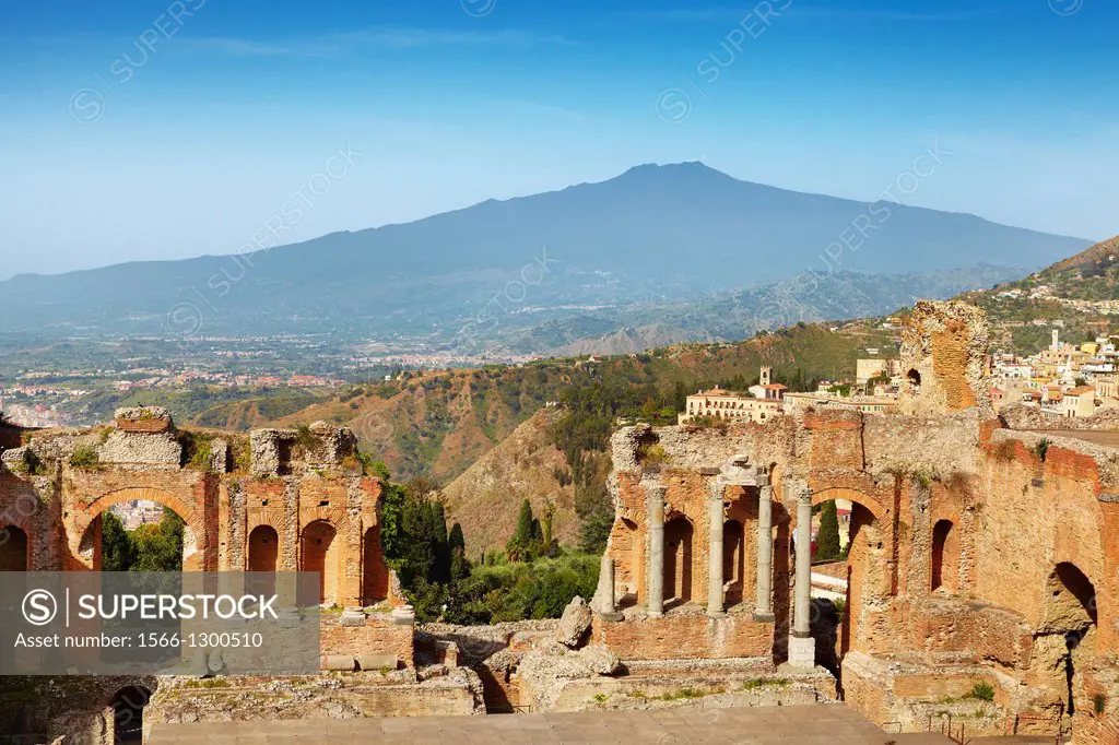 The Greek theatre in Taormina, Mount Etna Volcano in the distance, Sicily, Italy.