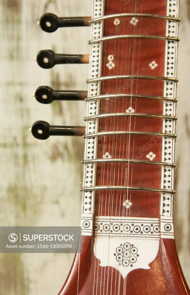 Close up abstract of a wood indian sitar string insturment of music in India.