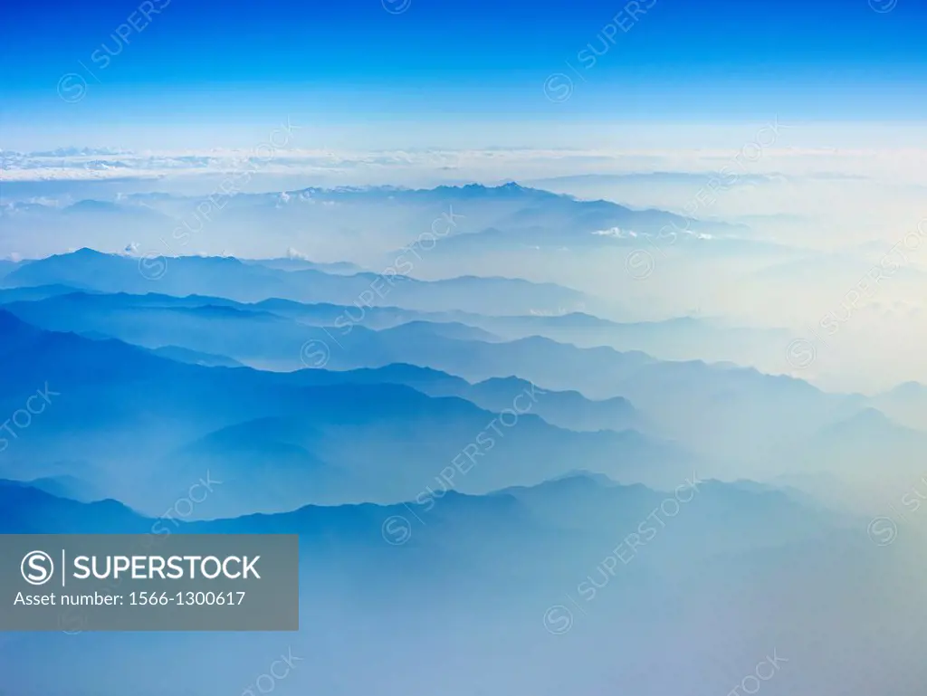 Aerial view of snow capped mountain range.