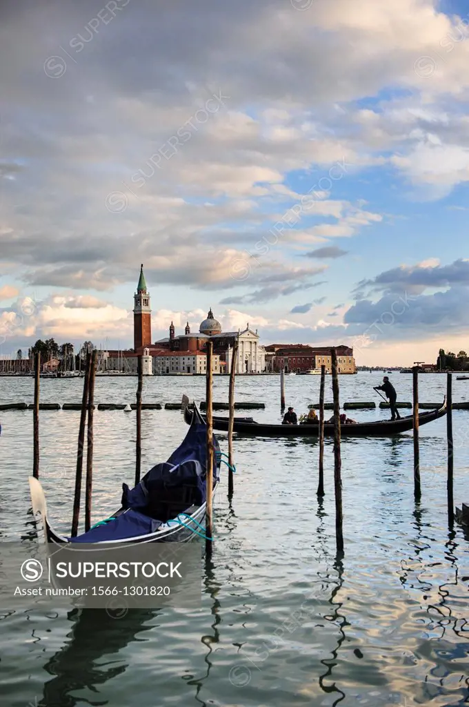 A gondolier sails at St. Mark´s basin, Venice, Italy.