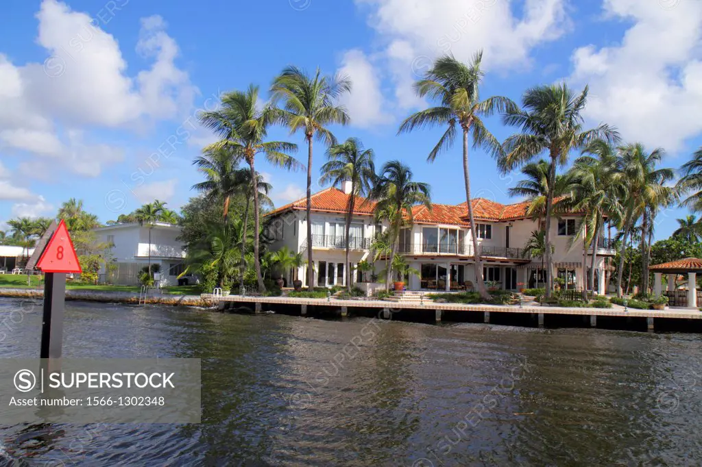 Florida, Ft. Fort Lauderdale, New River, waterfront, home, mansion, palm tree, navigation marker, boating, Isle of Capri Drive,.