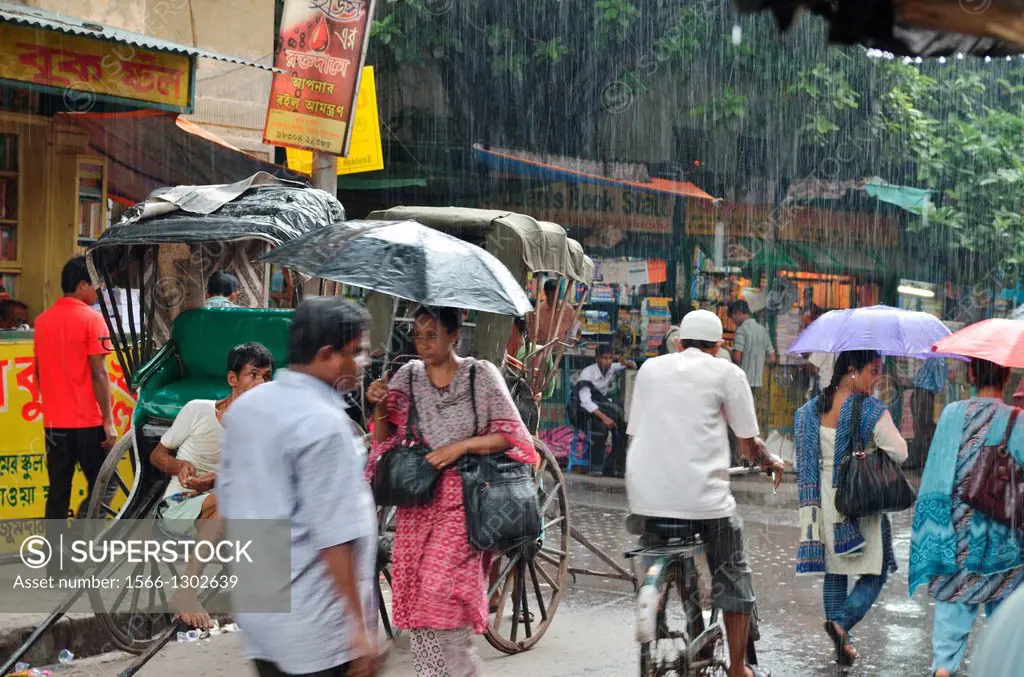 People walking under the rain, College Street, Kolkata, India.
