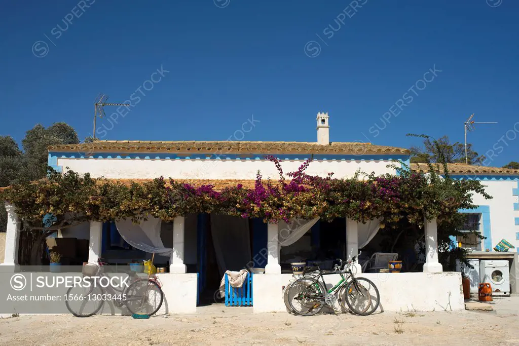 Bicycles in front of a Typical house in Formentera Island. Mediterranean. Pityuses, Balearic Islands, Spain, Europe.