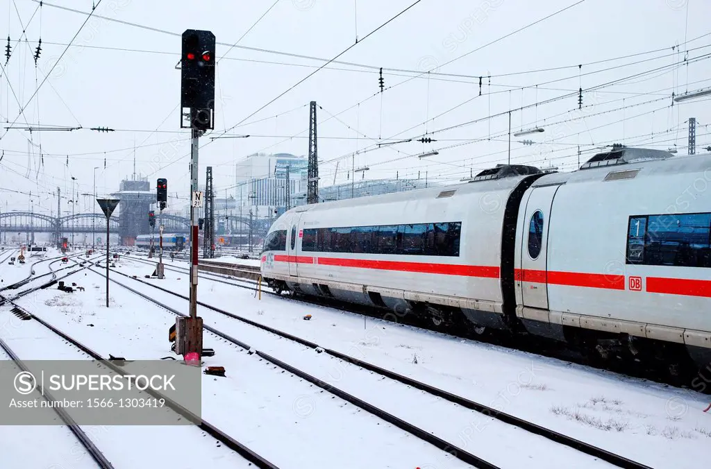ICE leaves Munich station in winter.
