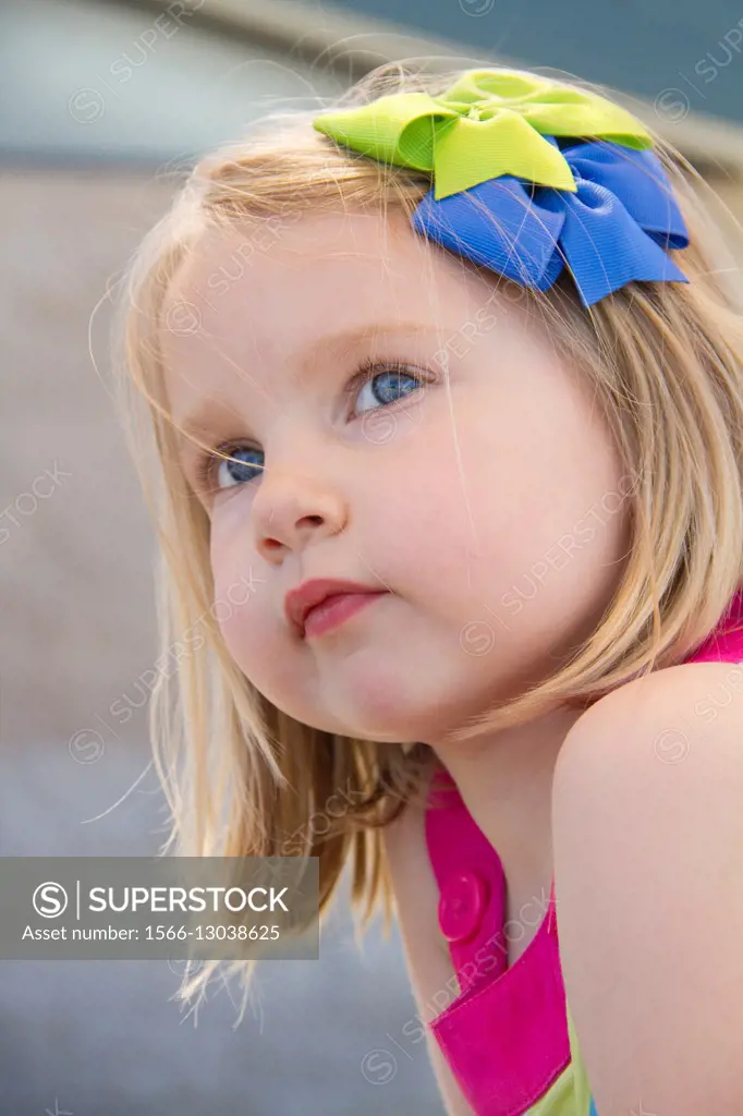 Close-up of a young girl outdoors.