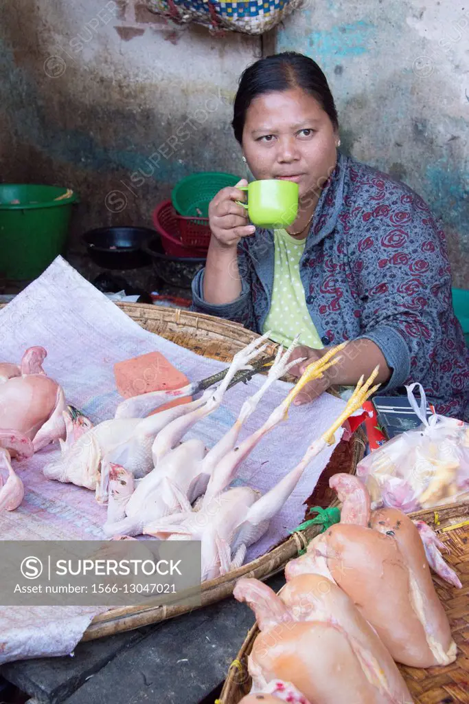 A woman sells chickens in the market in Bagan.