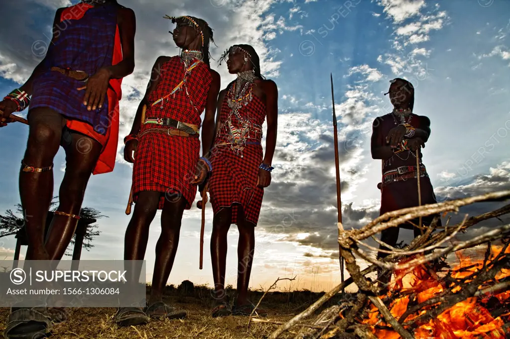 masais in kenia at sunset.