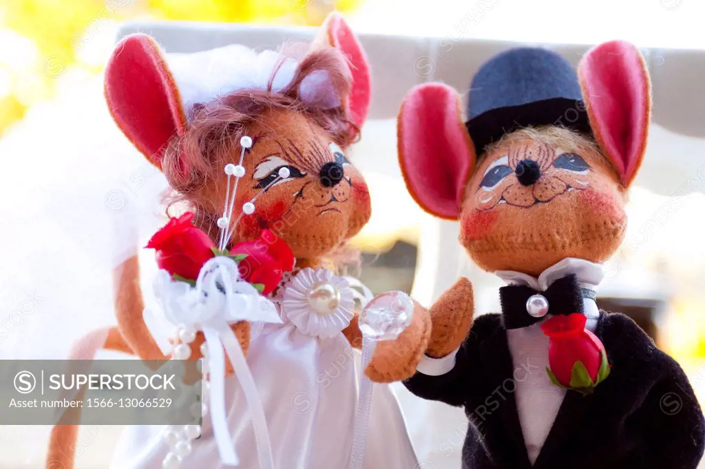 Bride and groom wedding mice on a dessert table at the reception.