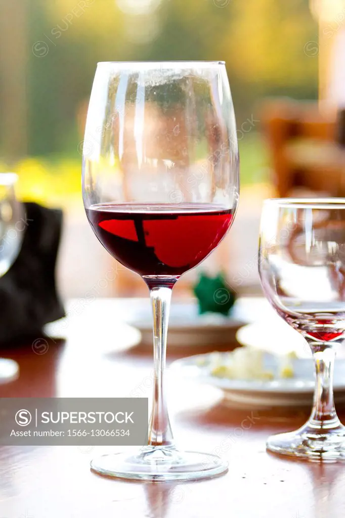 Red wine in a glass at a wedding reception.