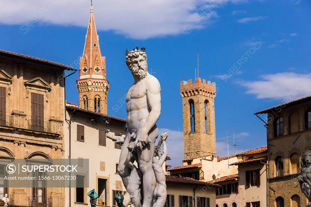 Italy, Toscana (Tuscany), Firenze (Florence) . The Fountain of Neptune by Bartolomeo Ammannati, on the background the bell-towers of Bargello and Badi...