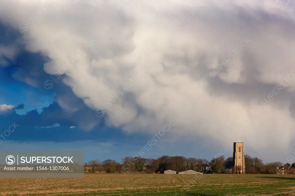 St James church Southrepps Norfolk and coming April storm.