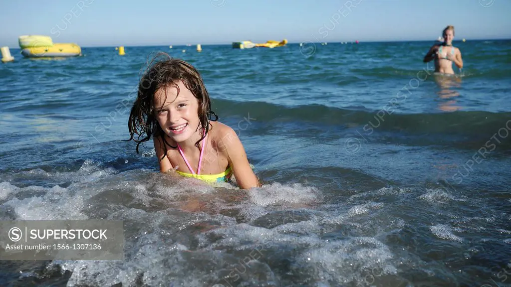 Girl playing in the beach