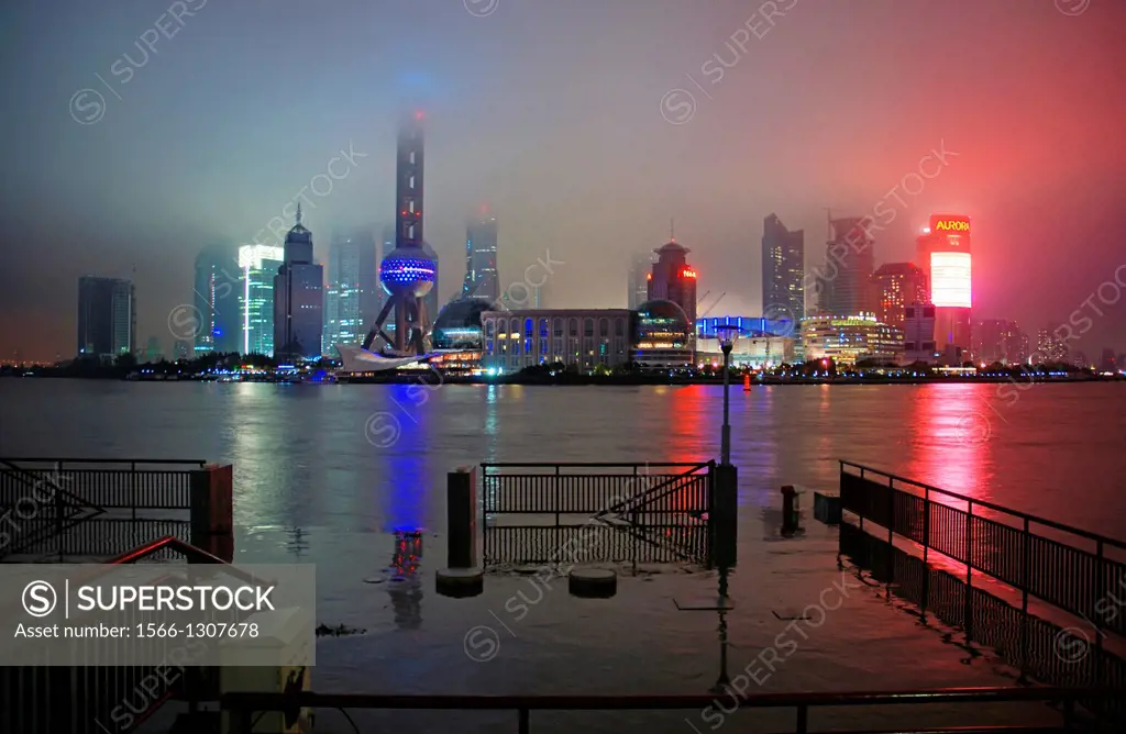 Oriental Pearl TV tower and Pudong skyline at rainy night, Shanghai, China.