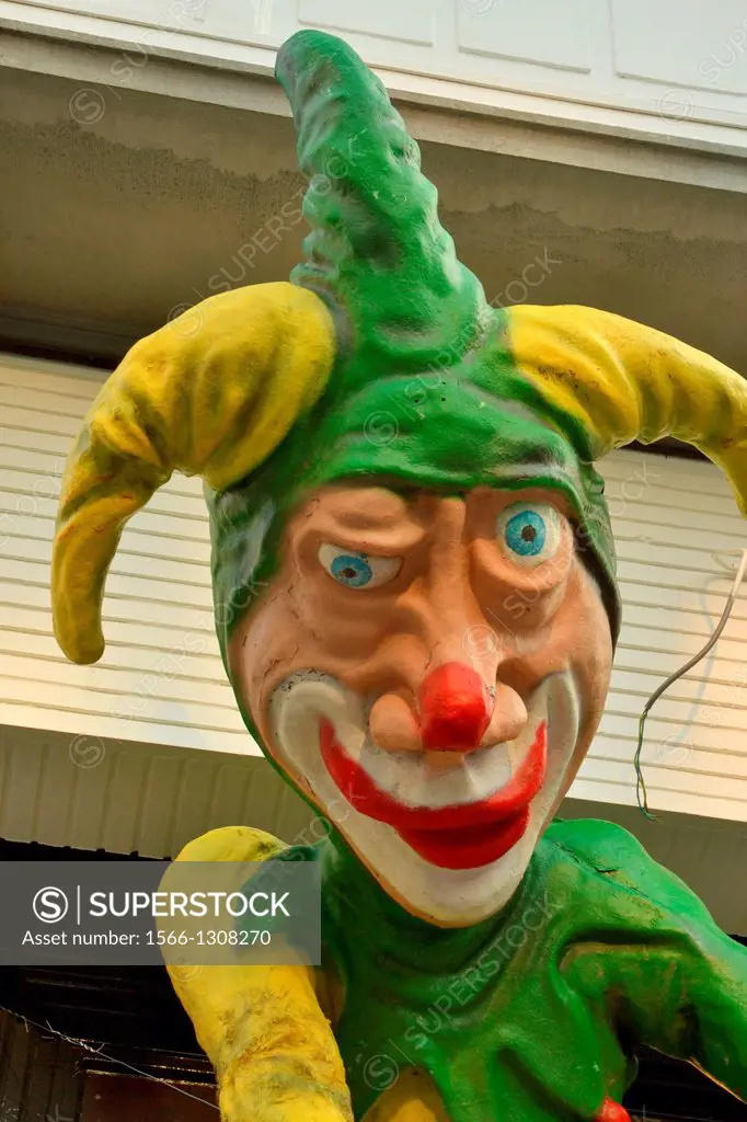 Paper mache jester hanging on door of restaurant. Decoration for Carnavale, in the Wijck neighbourhood of Maastricht.