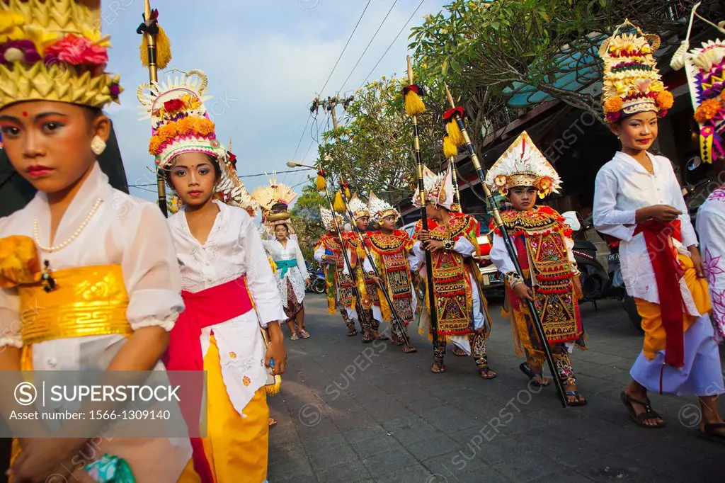 Children dressed for a ceremony. Religious procession, Ubud, Bali, Indonesia. South-East Asia, Asia.