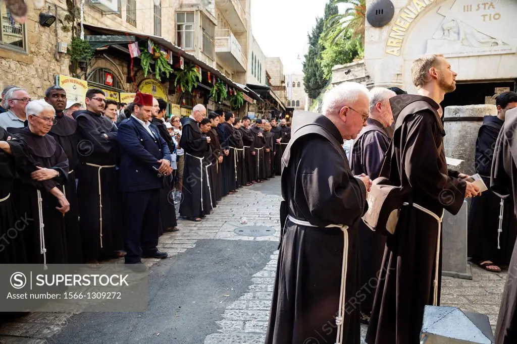 Franciscan monks at the Via Dolorosa during their regular friday procession in the old city, Jerusalem, Israel.