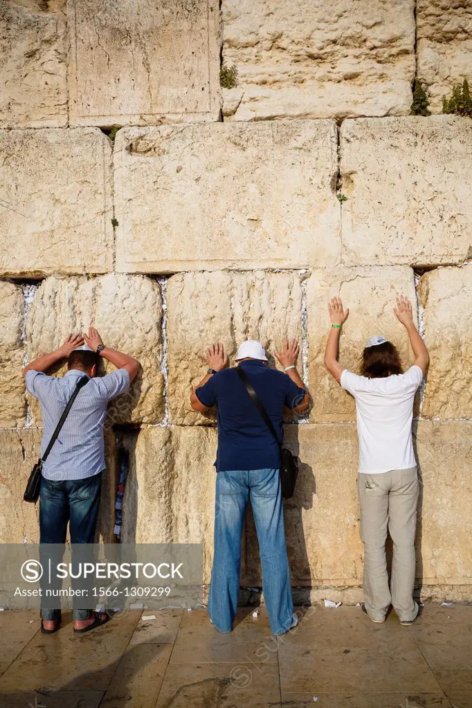 Jewish people praying at the wailing wall known also as the western wall , Jerusalem, Israel.