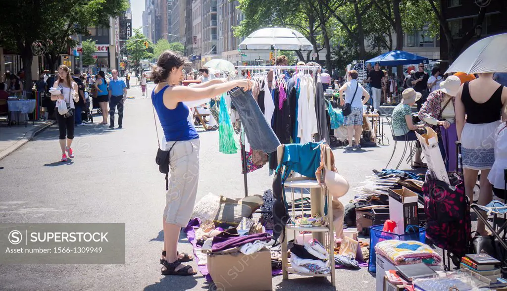 Shoppers search for bargains at the humongous Penn South Flea Market in the New York neighborhood of Chelsea. Once a year the flea market, like Brigad...