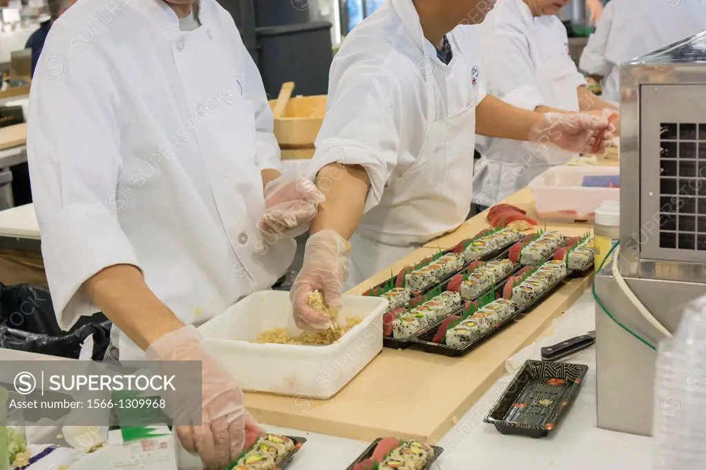 Chefs prepare sushi in the Chelsea Market in New York. The market is a favorite destination for tourists and locals alike abounding in a myriad collec...