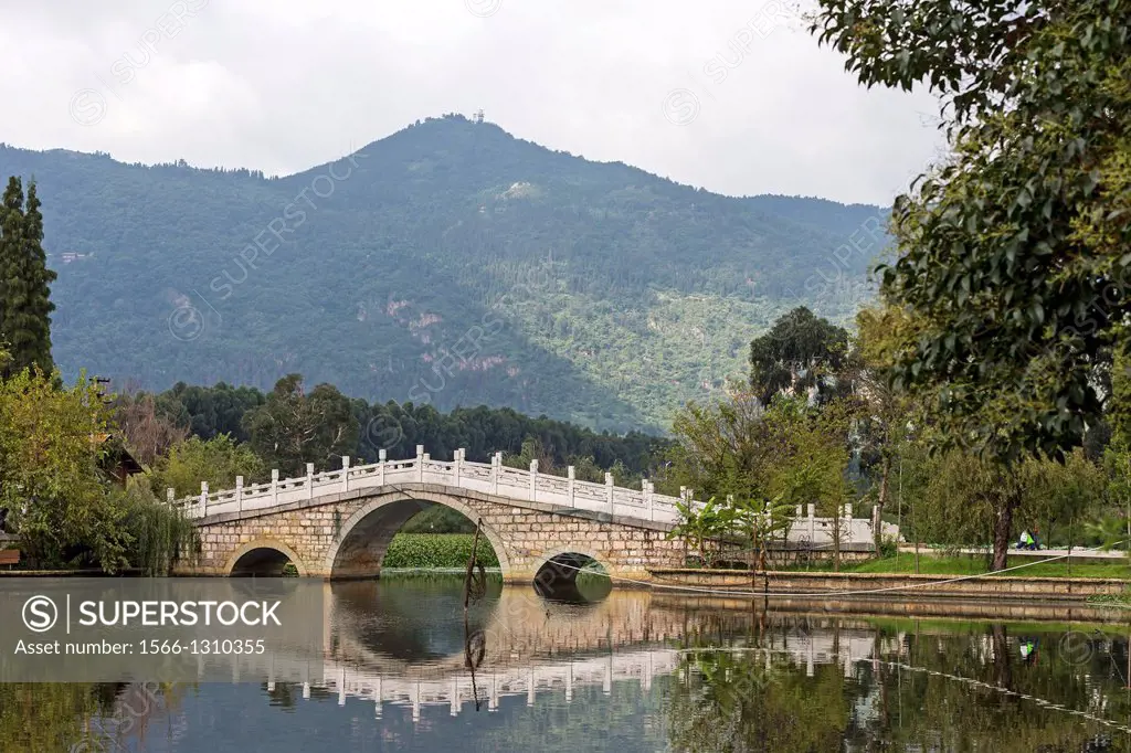 Bridge over lake, Yunnan ethnic village, Kunming Ethnic Minorities Village, Kunming, Dongchuan District, Yunnan province, China