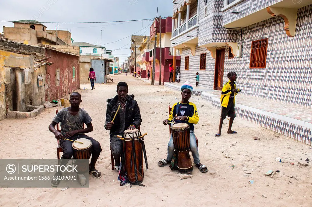 Boys playing drums on the streets of Saint-Louis.