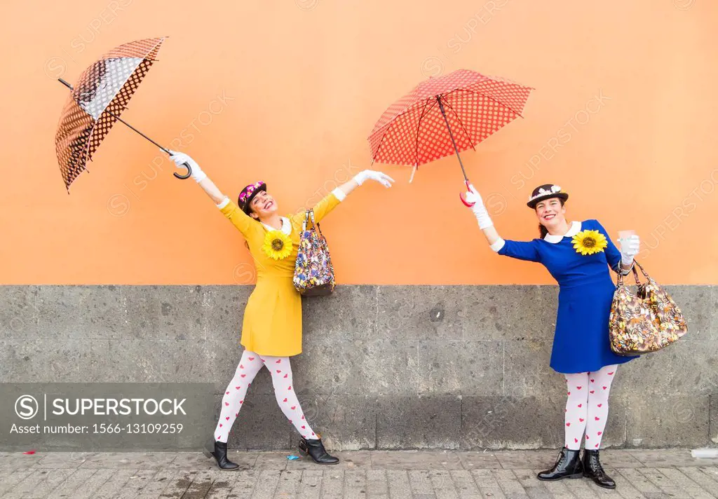 Two women dressed as Mary Poppins at carnival in Las Palmas, Gran Canaria, Canary Islands, Spain.
