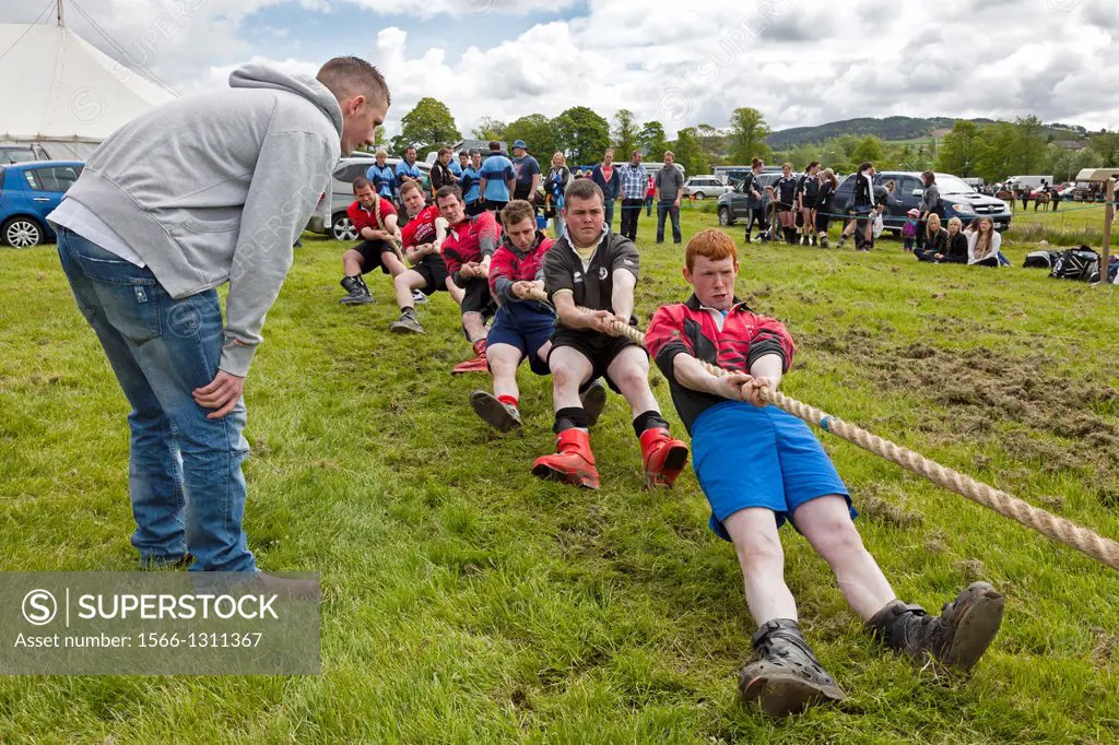 Men taking part in a tug of war competition, Scotland.