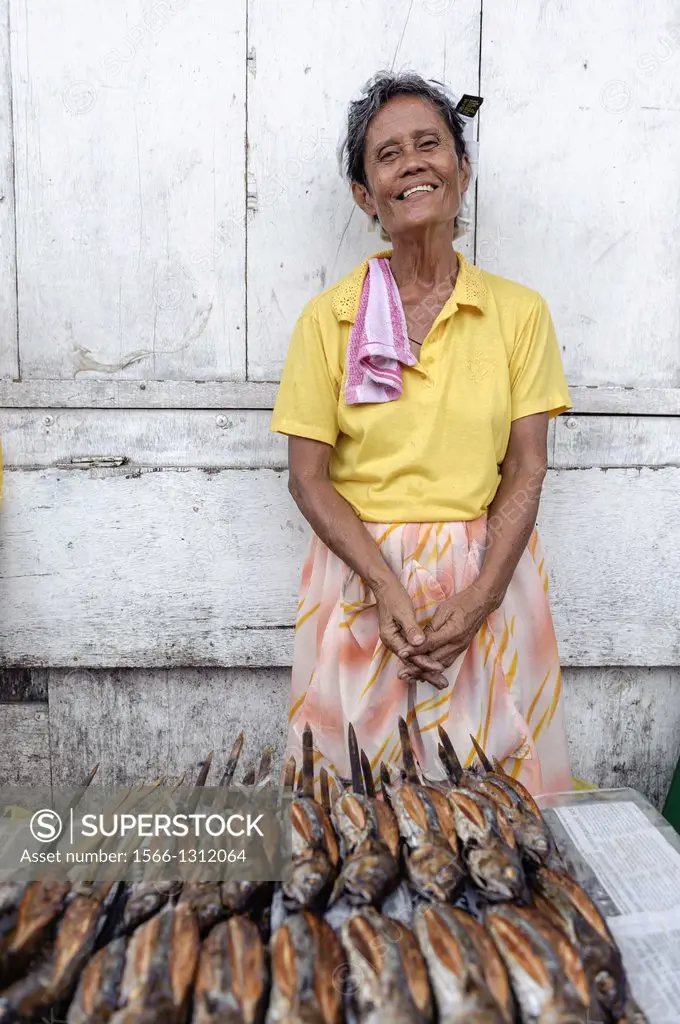Woman selling fish in the streets of Carbon market, Cebu, Visayas, Philippines, South East Asia.