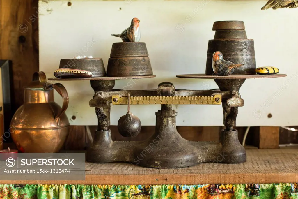 an old weighing scale with weights.